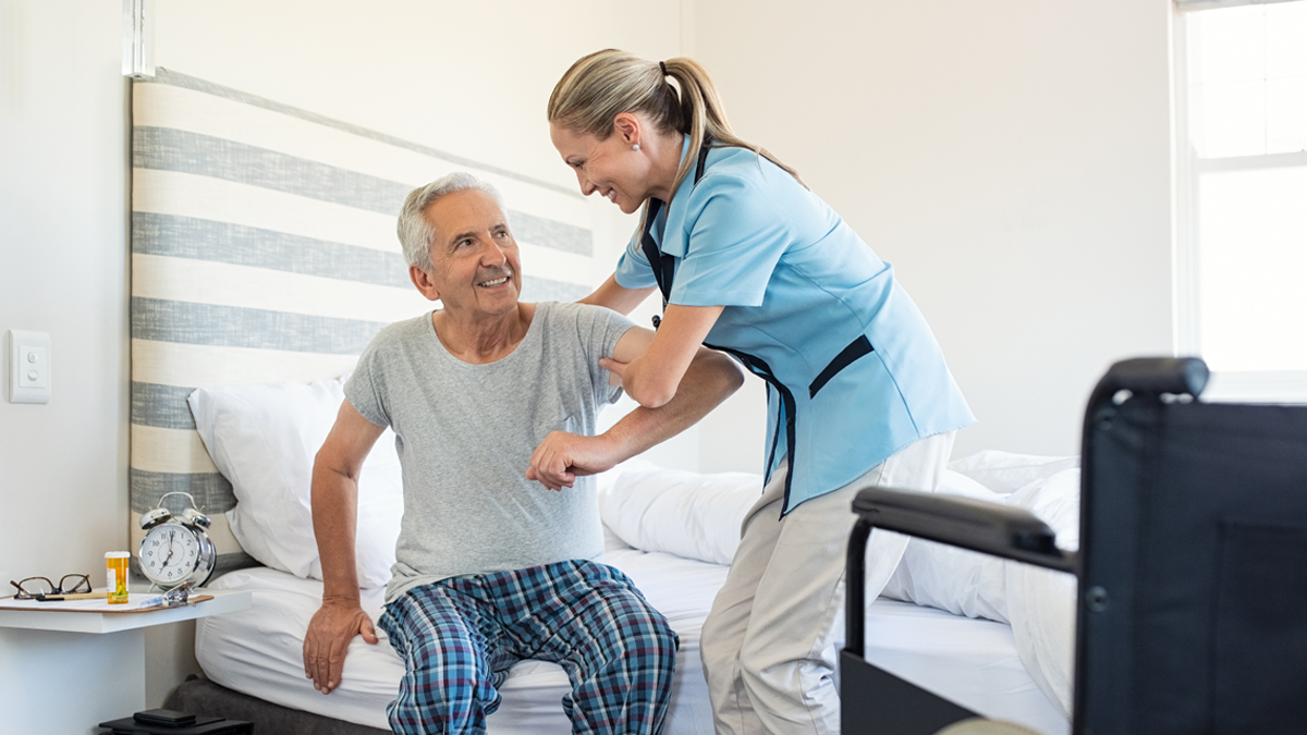 Photo of an older man with a younger woman