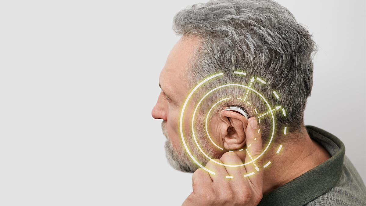 Photo of a man touching his ear